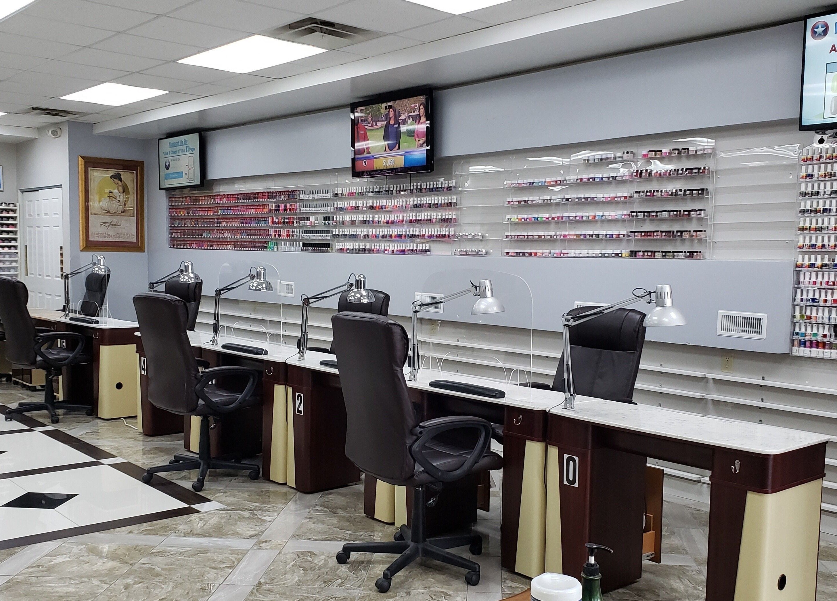 Modern nail salon interior at NT Nails and Spa, West Chester, Ohio, US, featuring elegant manicure stations.