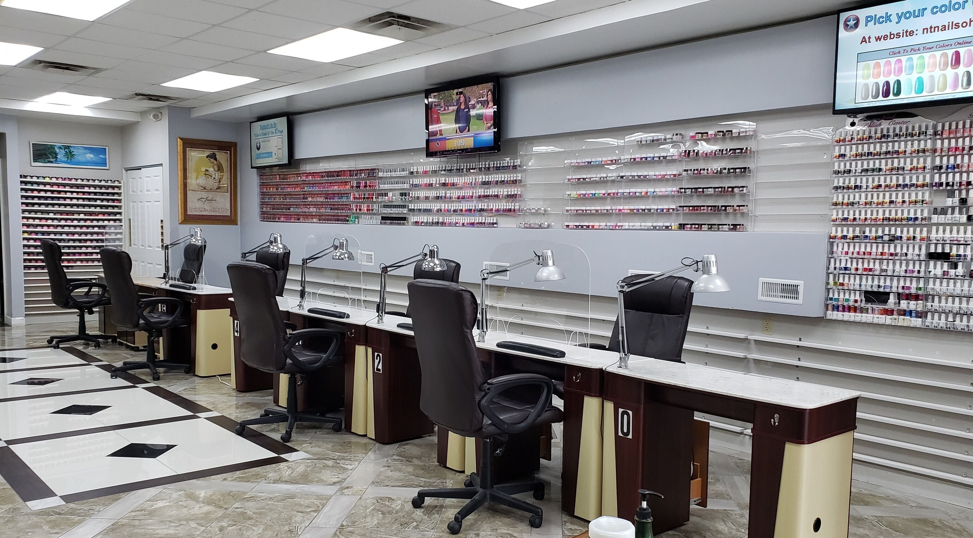 Modern nail salon interior at NT Nails and Spa, West Chester, Ohio, US, featuring elegant manicure stations.