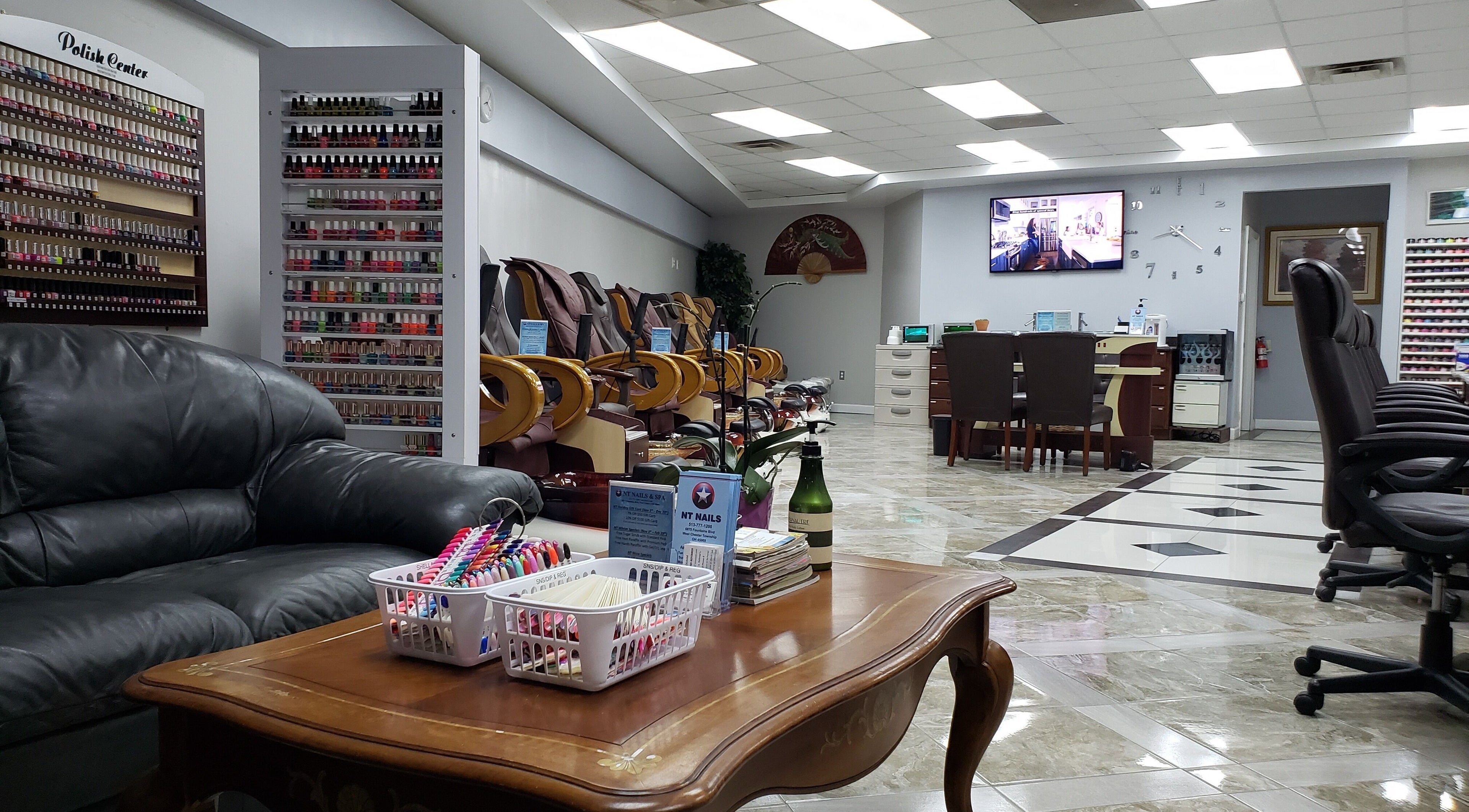 Interior of NT Nails and Spa in West Chester, Ohio, US, featuring cozy seating and a vast polish selection.