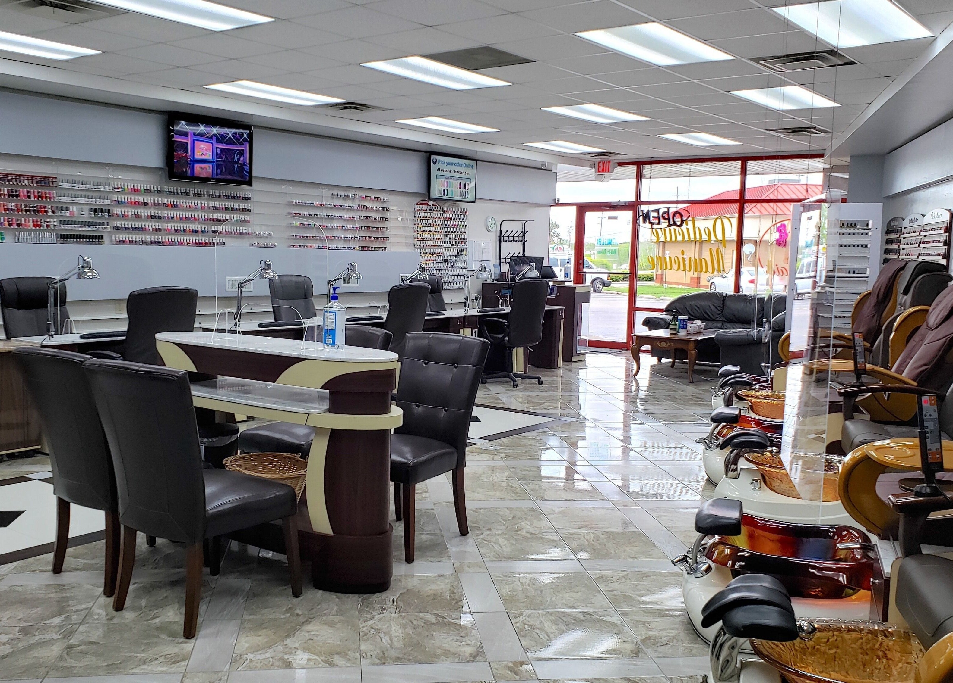 Inside NT Nails and Spa showcasing plush seating and nail stations in West Chester, Ohio, US.