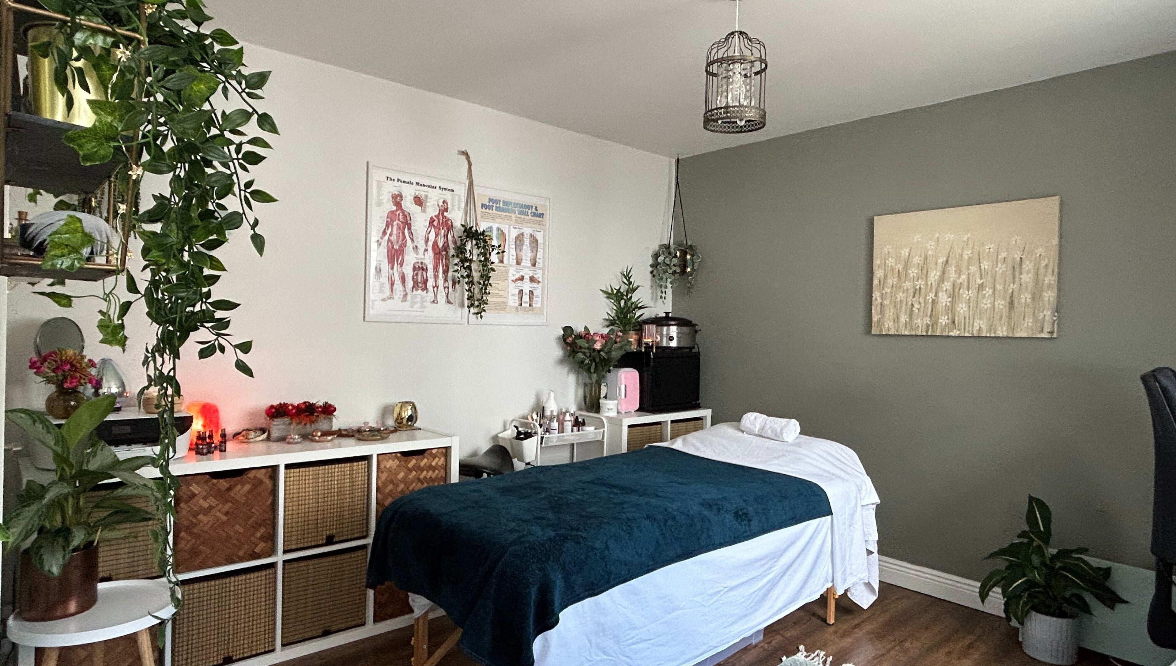 Cozy treatment room at Renew Therapies Sandyford, County Dublin, IE with massage bed and serene decor.