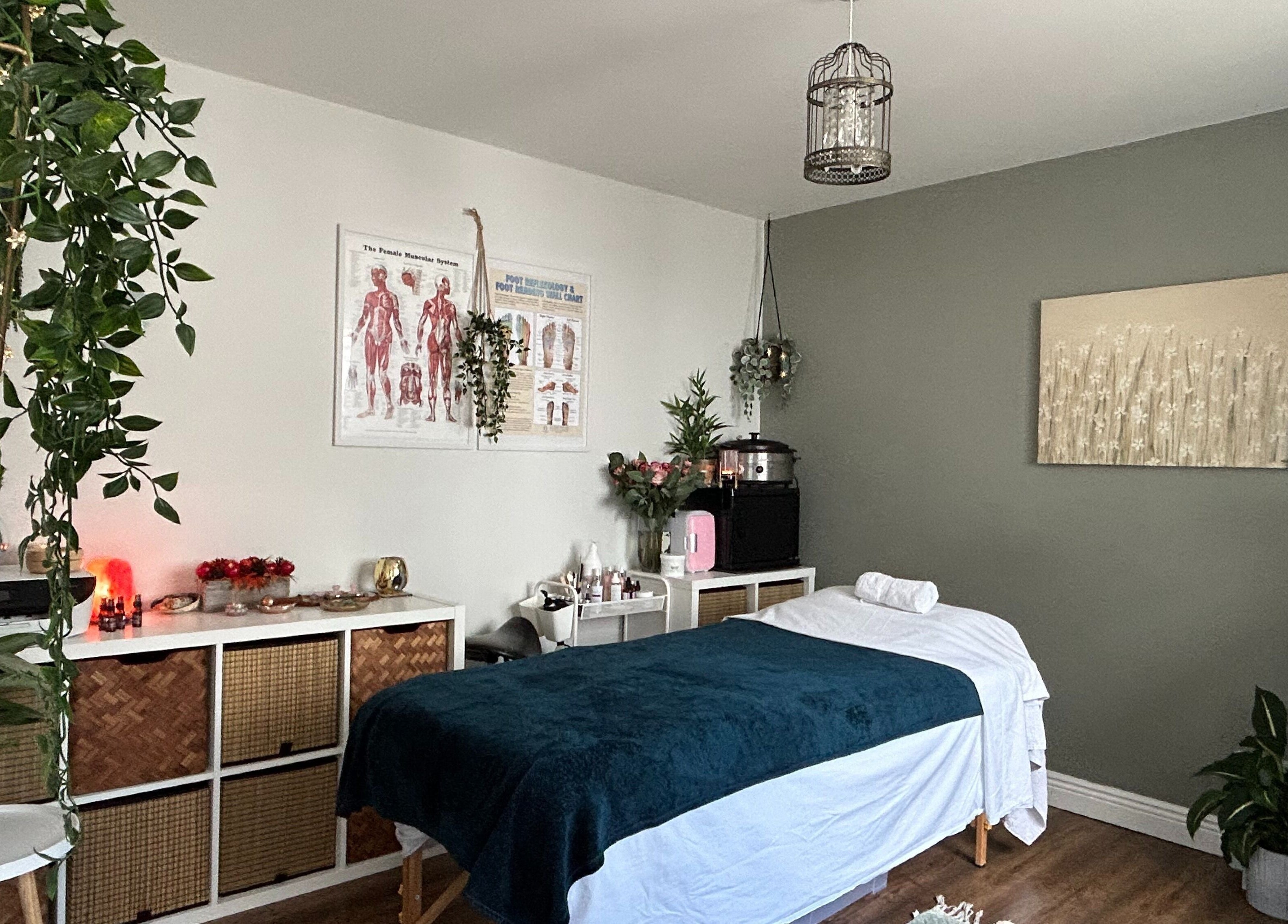 Cozy treatment room at Renew Therapies Sandyford, County Dublin, IE with massage bed and serene decor.
