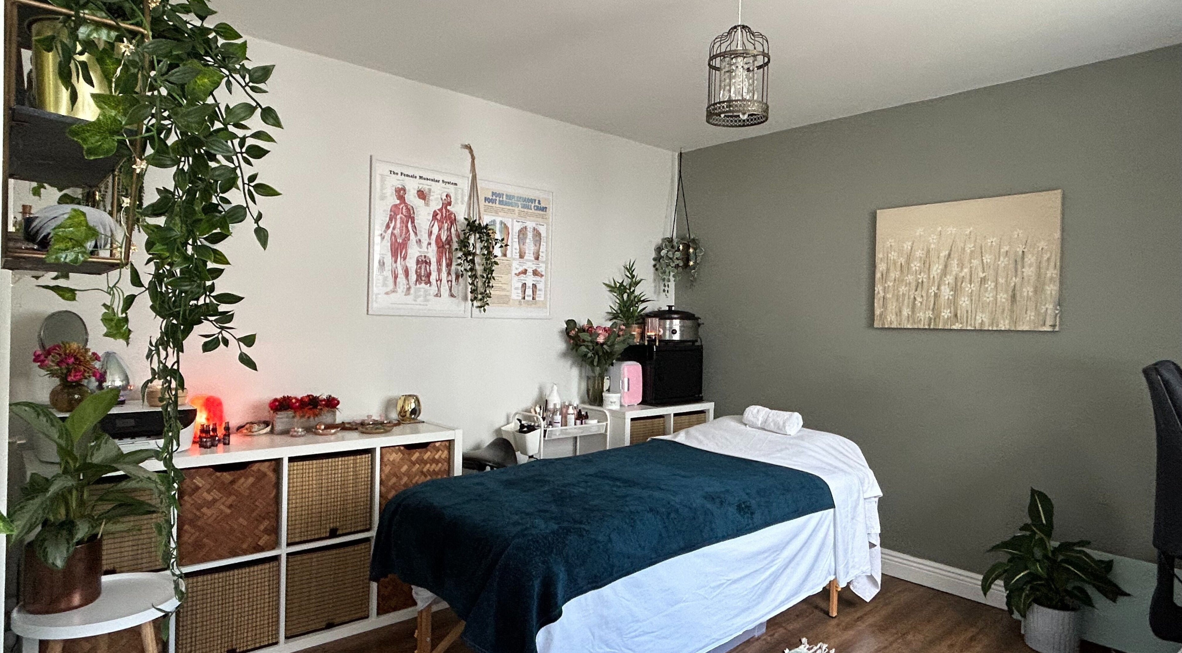 Cozy treatment room at Renew Therapies Sandyford, County Dublin, IE with massage bed and serene decor.