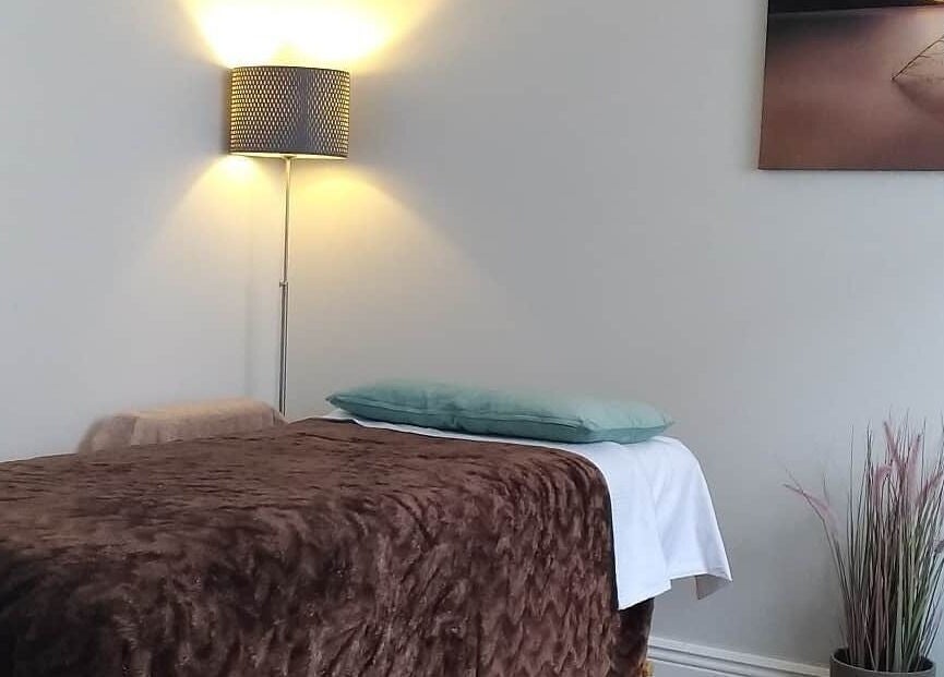 Cozy therapy room at Renew Therapies Sandyford, County Dublin, IE, featuring a plush brown treatment bed.