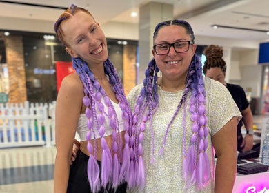 Smiling customers with vibrant braids at Syd Braid Bar - Eastgardens, Eastgardens, New South Wales, AU.