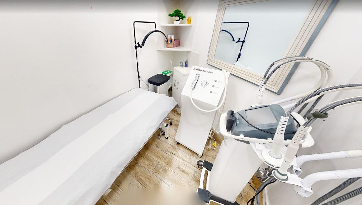 Serene treatment room at Nu Wave Laser Clinic in London, England, GB, featuring advanced cosmetic equipment.