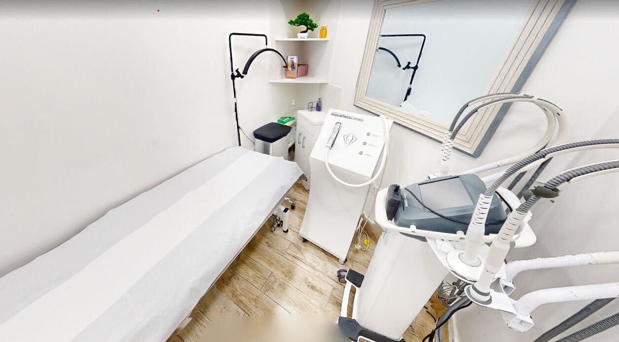 Serene treatment room at Nu Wave Laser Clinic in London, England, GB, featuring advanced cosmetic equipment.