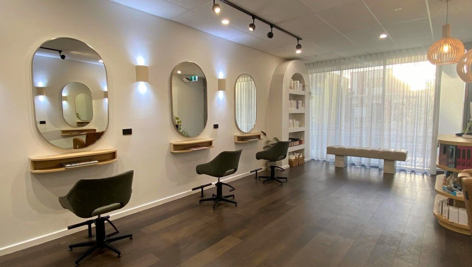 Perth Curls salon in Leederville, Western Australia with elegant chairs and modern mirrors.
