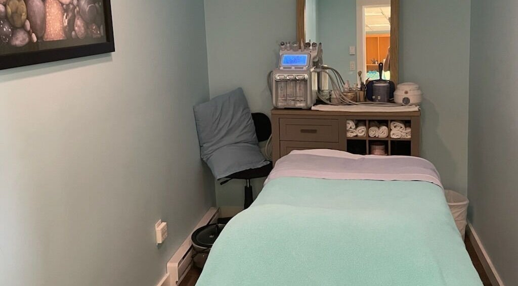 Relaxing treatment room at Ocean Blue Day Spa, Port Alberni, British Columbia, CA with massage table and equipment.