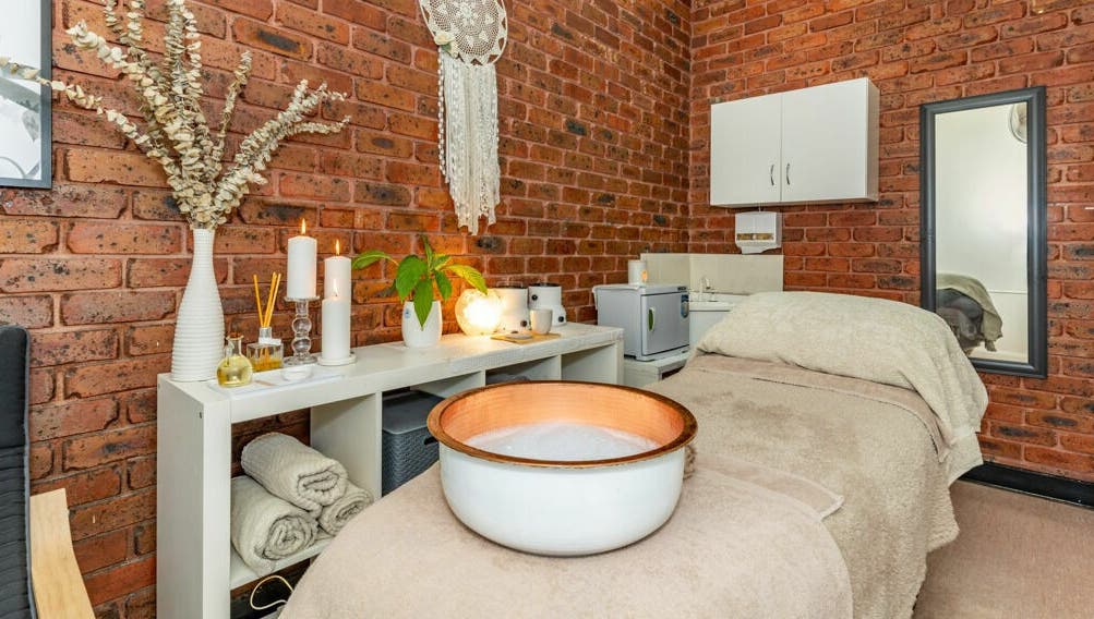 Tranquil spa room at Nature's Beauty Secrets in Melbourne, Victoria, AU with cozy decor and soft lighting.