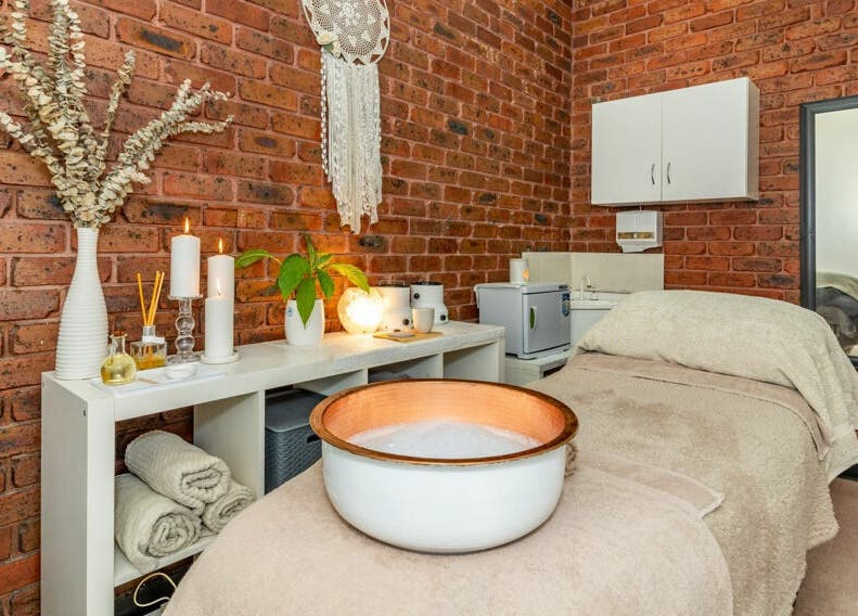 Tranquil spa room at Nature's Beauty Secrets in Melbourne, Victoria, AU with cozy decor and soft lighting.