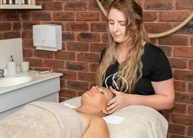 Relaxing massage session at Nature's Beauty Secrets, Melbourne, Victoria, AU with warm brick interior.