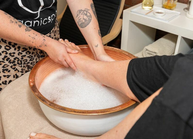 Relaxing foot soak at Nature's Beauty Secrets, Melbourne, Victoria, AU, showcasing serene spa treatments.