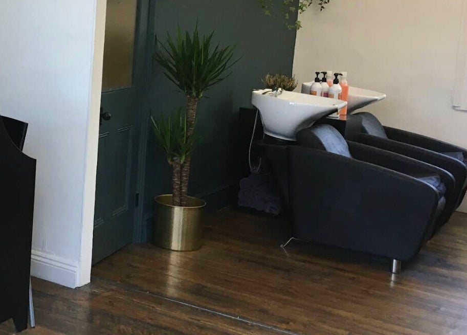 Chic hair washing station at Jane Edwards, London, England, GB with sleek chairs and stylish decor.