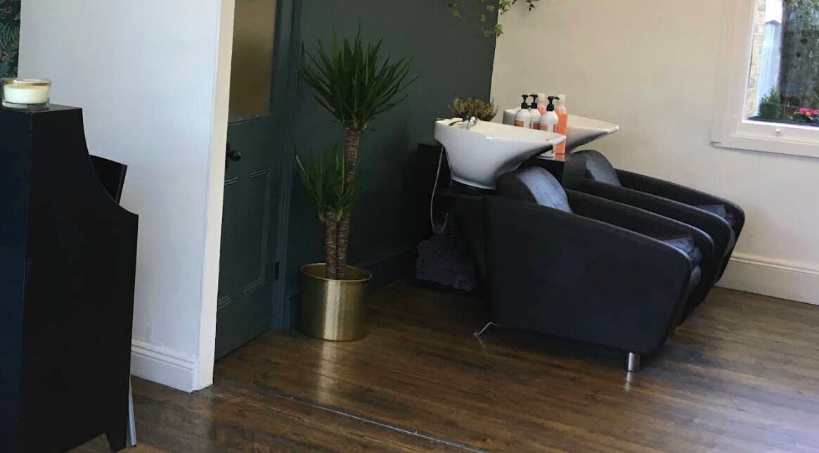 Chic hair washing station at Jane Edwards, London, England, GB with sleek chairs and stylish decor.