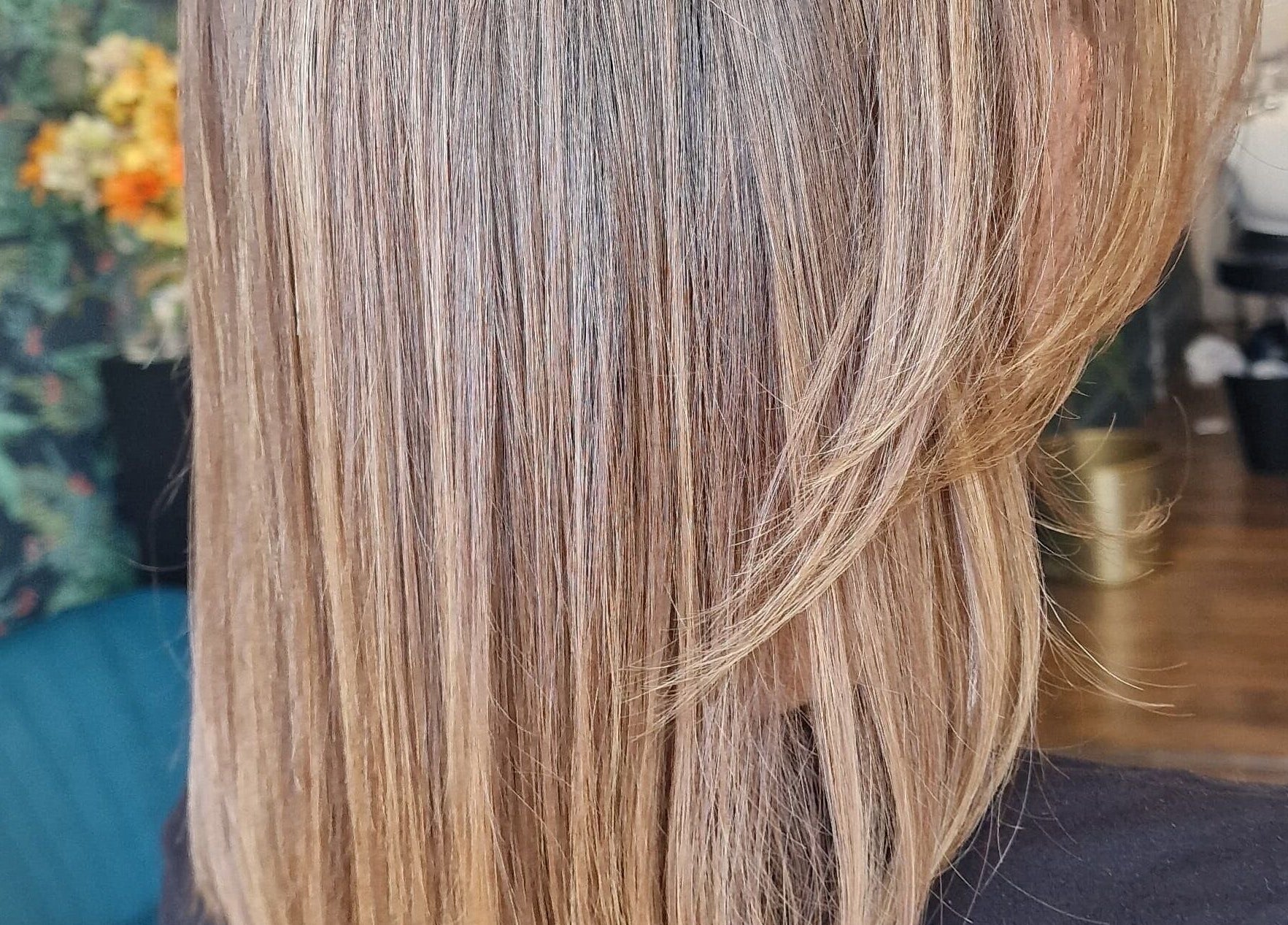 Smooth blonde hairstyle at Jane Edwards, London, England, GB salon showcasing professional haircare.