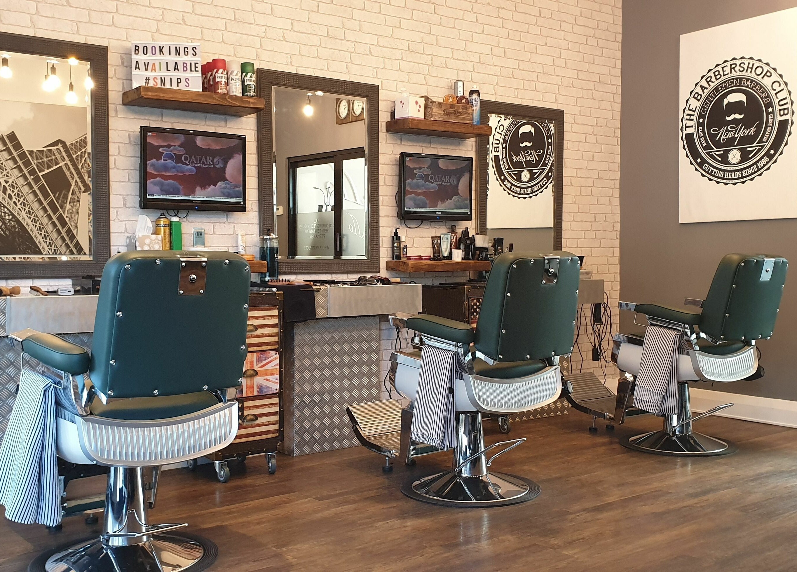 Chic interior of Mr Snips Heswall, a modern barbershop in Heswall, England, GB, featuring classic chairs and decor.
