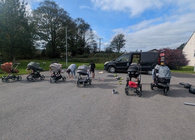 Group fitness with strollers at Kerrie's PMA Fitness, Tenby, Wales, GB. Outdoor wellness class.