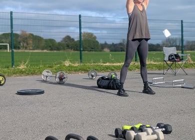 Outdoor fitness training at Kerrie’s PMA fitness, Tenby, Wales, GB with weights and equipment.