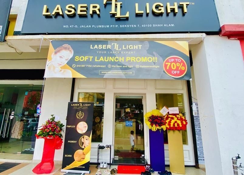 Front view of Laser Light Skin Centre Shah Alam, Selangor, MY with a soft launch promo banner.