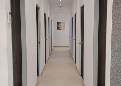 Sleek hallway at Laser Light Skin Centre (Cheras Permaisuri), Kuala Lumpur, offers serene beauty experience.