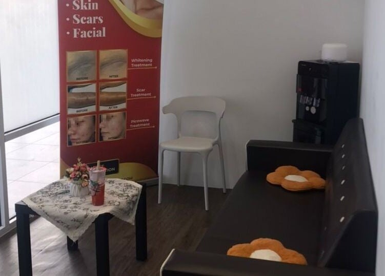 Comfortable waiting area at Laser Light Skin Centre in Seberang Perai, Pulau Pinang, MY, featuring skincare display.