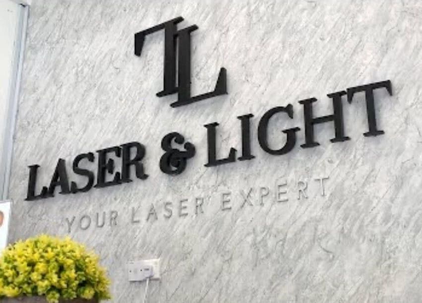 Entrance sign of Laser Light Skin Centre, Kuantan, featuring sleek branding on marble.