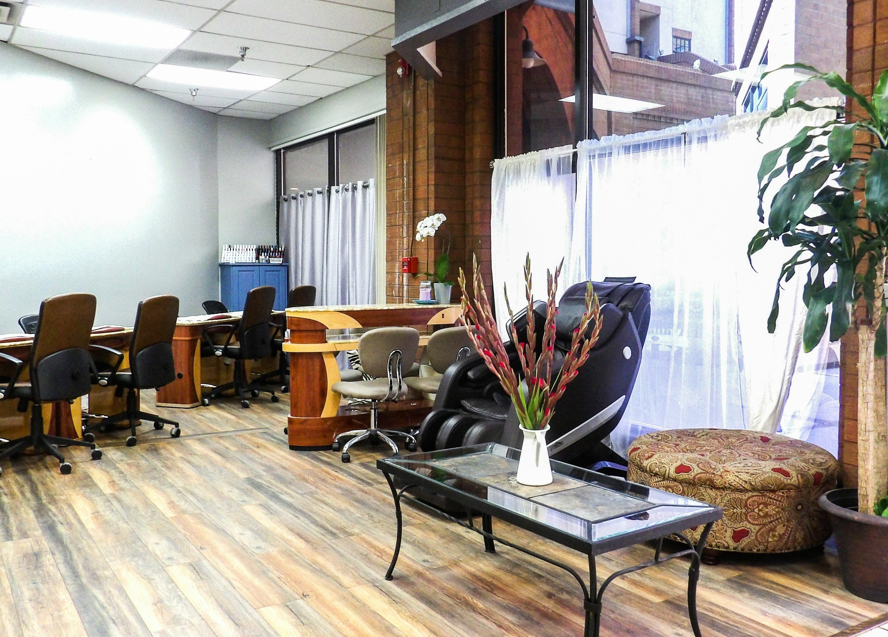 Modern interior of Flawless Nail Bar in Denver, Colorado, US featuring cozy seating and natural decor.