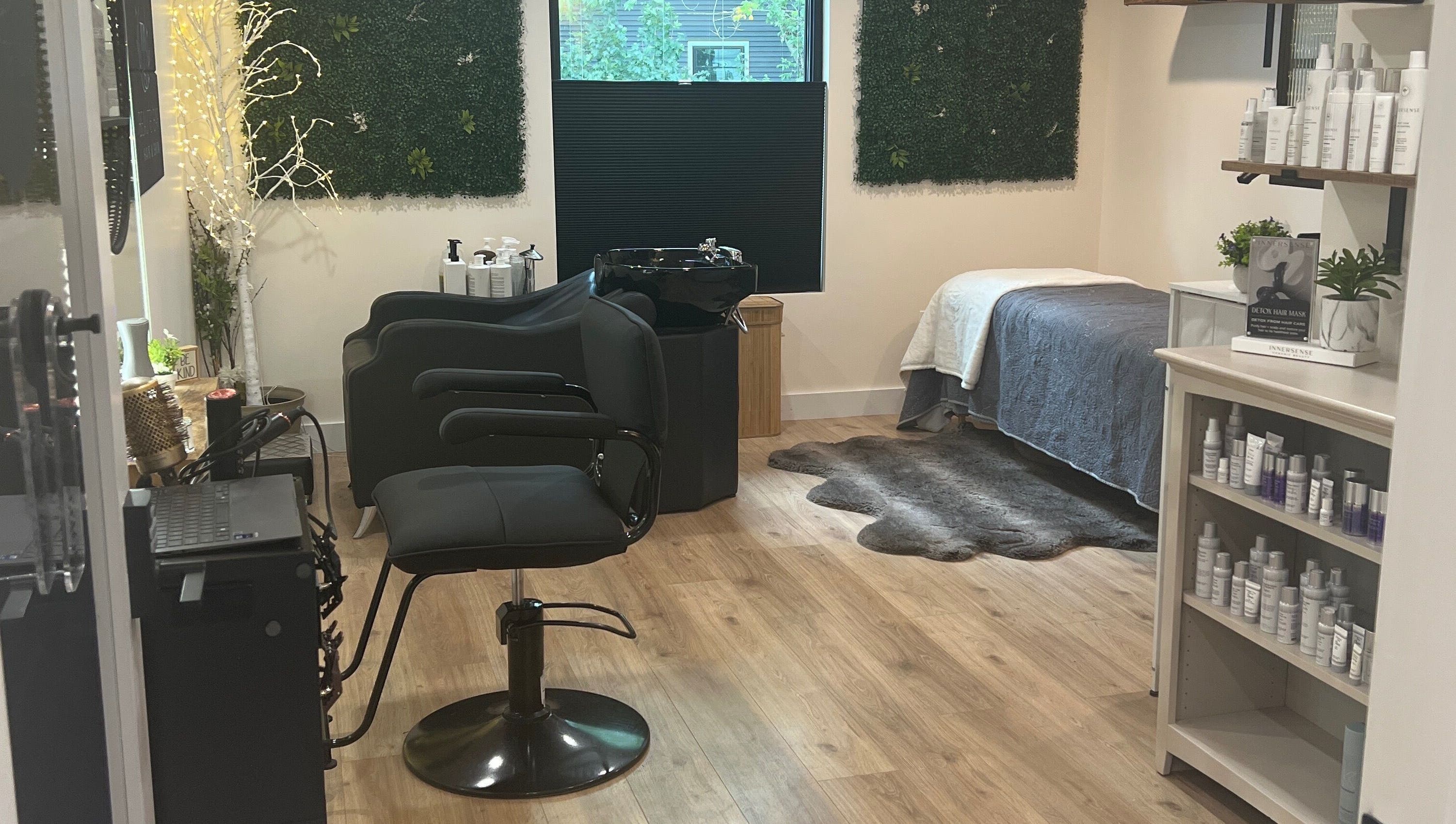 Chic interior of 771 Beaute’ Bar in Buxton, Maine featuring a styling chair, products, and serene decor.