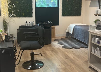 Chic interior of 771 Beaute’ Bar in Buxton, Maine featuring a styling chair, products, and serene decor.
