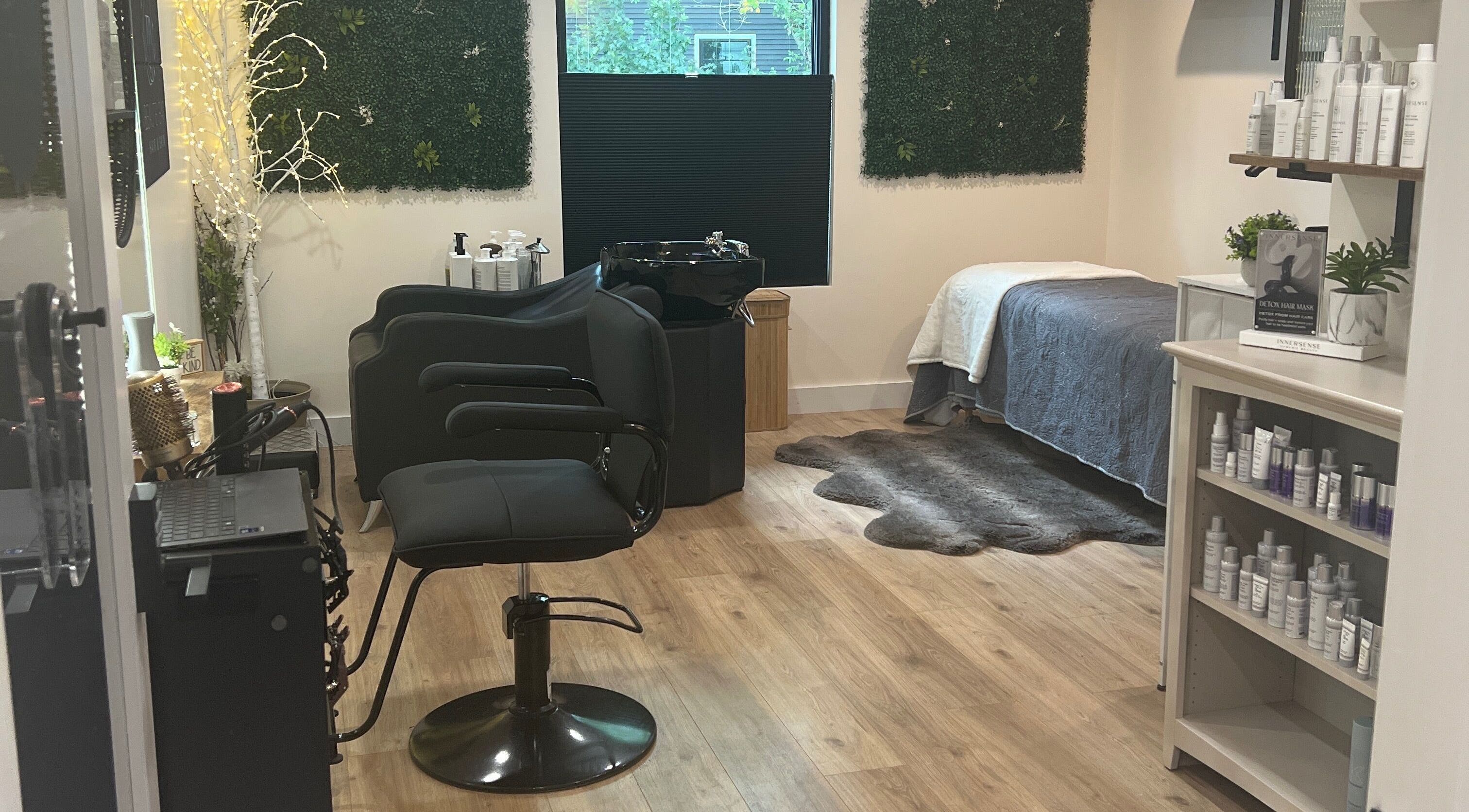 Chic interior of 771 Beaute’ Bar in Buxton, Maine featuring a styling chair, products, and serene decor.