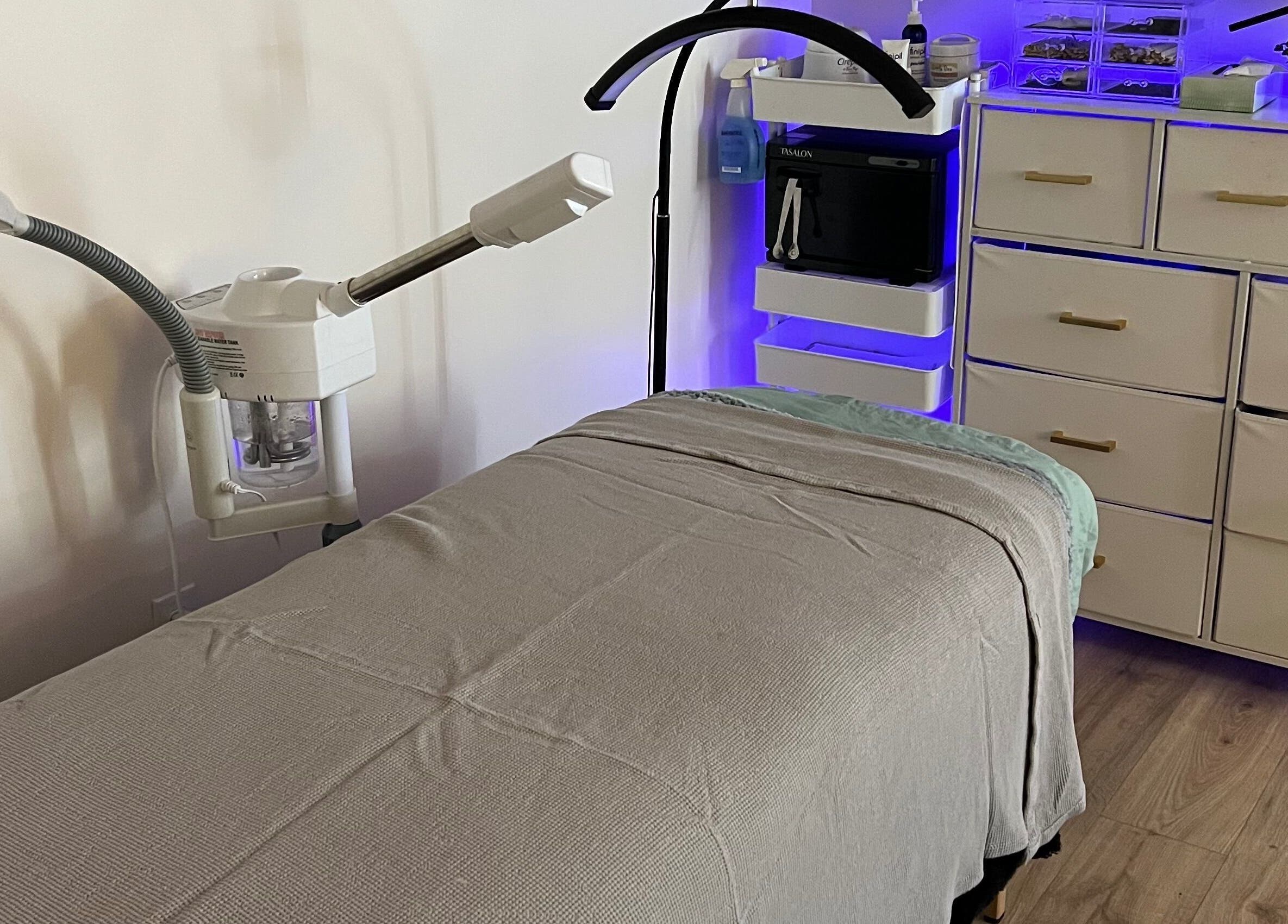 Modern treatment room at 771 Beaute’ Bar in Buxton, Maine, US featuring a cozy massage table.