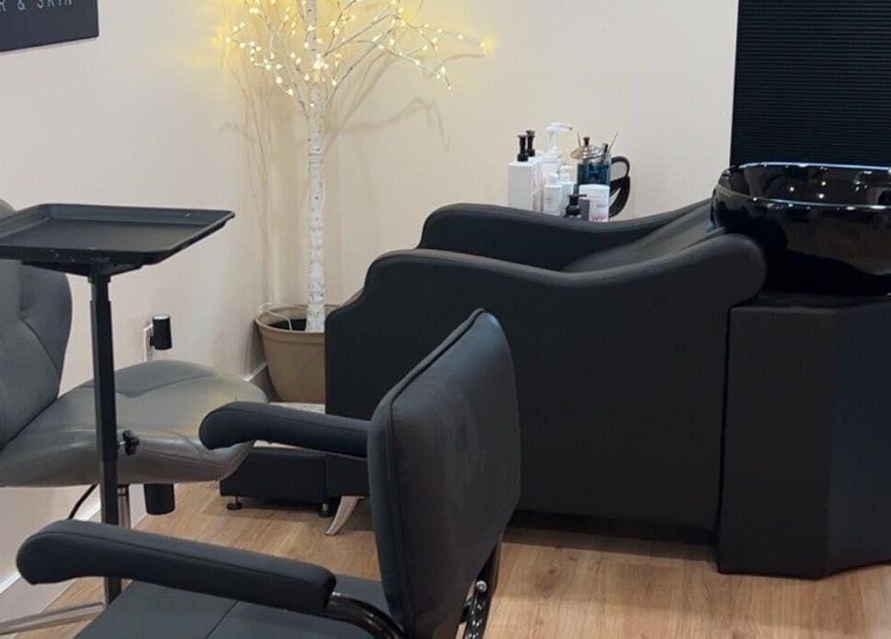 Elegant salon setup at 771 Beaute’ Bar in Buxton, Maine, US featuring modern styling chairs and wash basin.