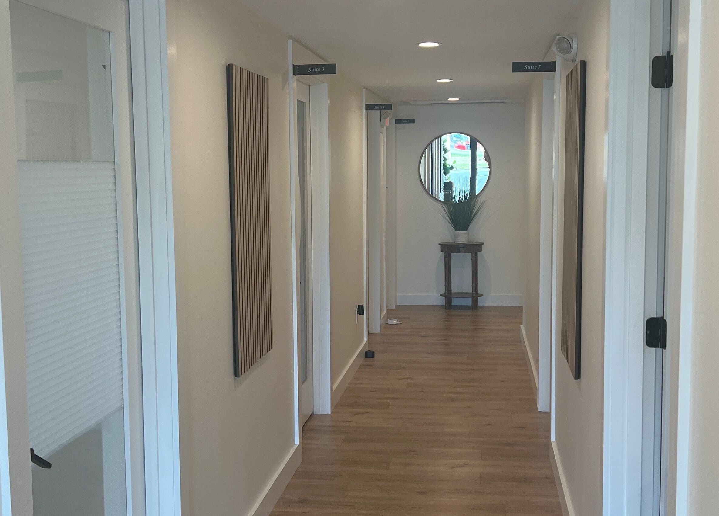 Elegant hallway at 771 Beaute’ Bar, Buxton, Maine, US with stylish decor and natural lighting.