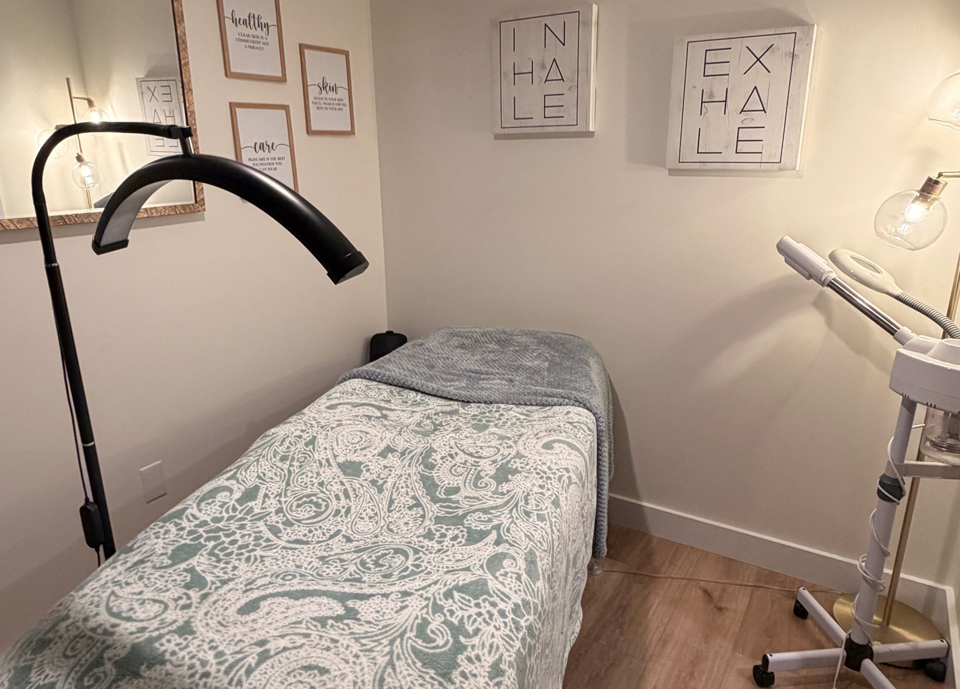 Tranquil massage room at 771 Beaute’ Bar in Buxton, Maine, US featuring a treatment bed and gentle lighting.