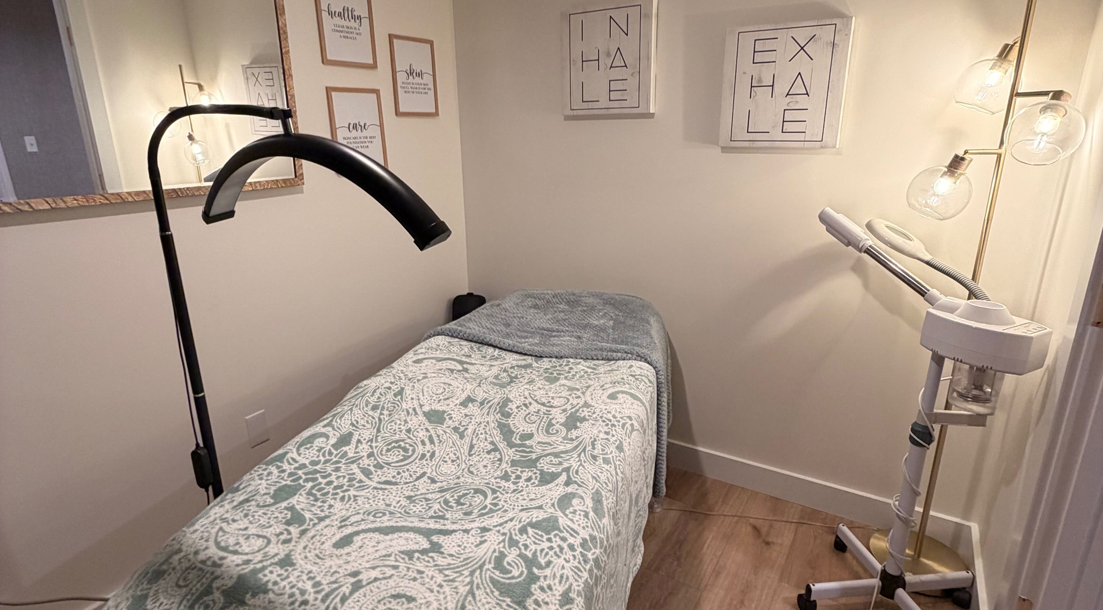 Tranquil massage room at 771 Beaute’ Bar in Buxton, Maine, US featuring a treatment bed and gentle lighting.
