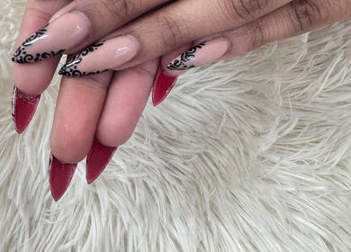 Stylish red and black patterned nails at Blushed On! Nails&Beauty Verulam, Verulam, KwaZulu-Natal, ZA.