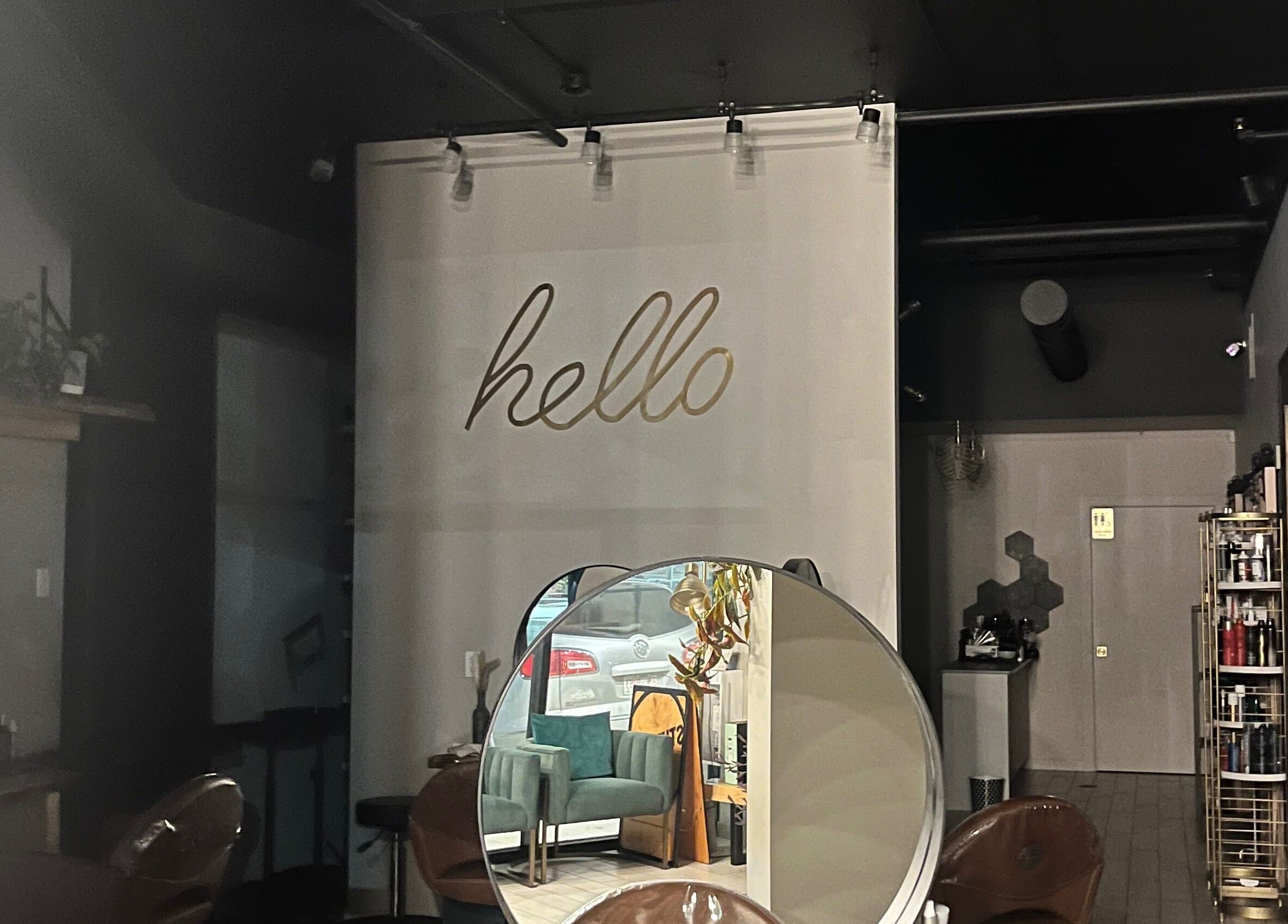 Inviting interior of Studio29 in Edmonton, Alberta, CA. Features sleek design with mirrors and cozy seating.