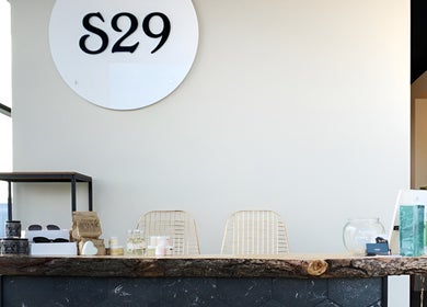 Reception area at Studio29, featuring a rustic wooden counter in Edmonton, Alberta, CA.
