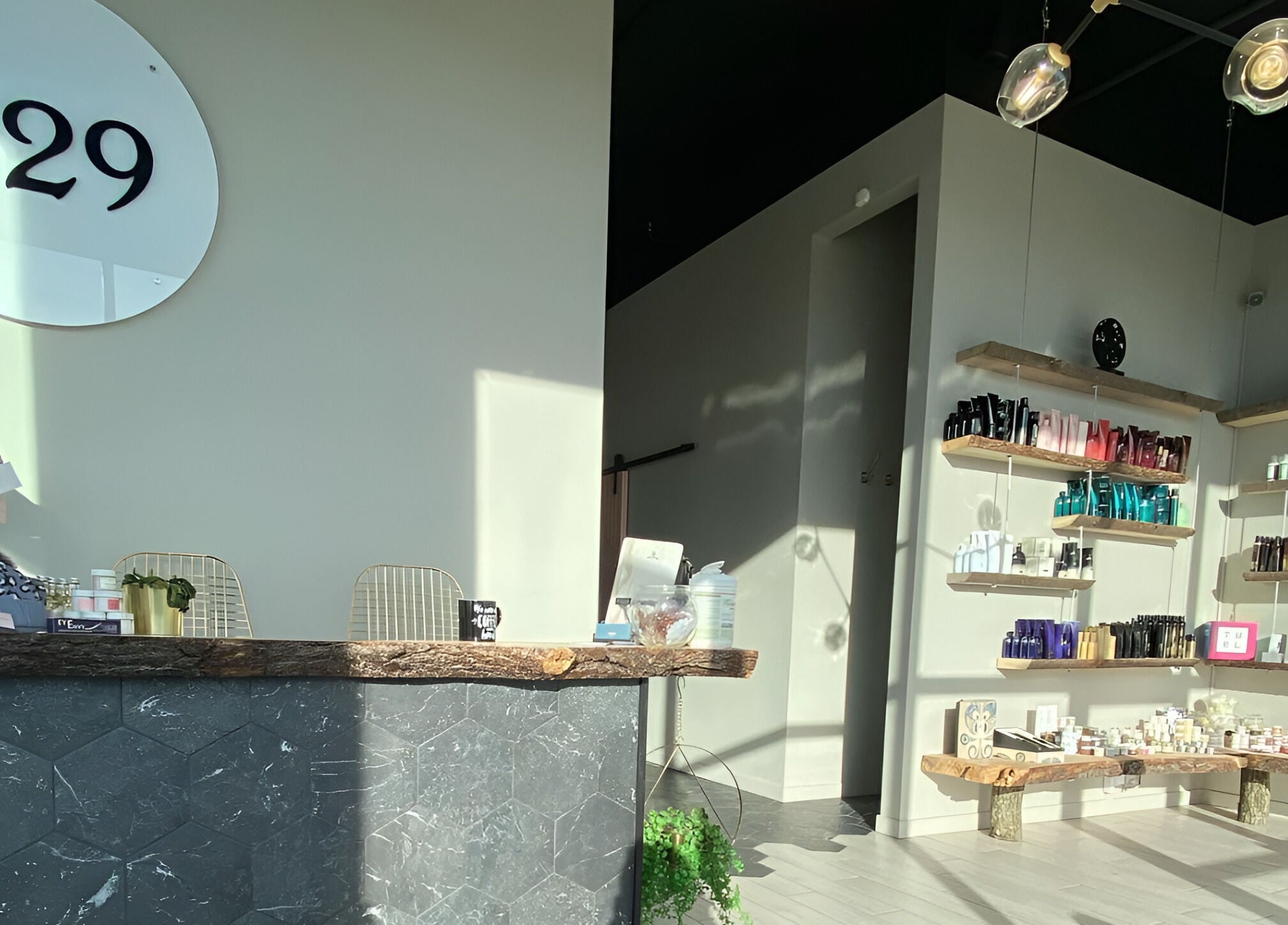 Reception area of Studio29 in Edmonton, Alberta, CA, featuring elegant product displays and modern decor.