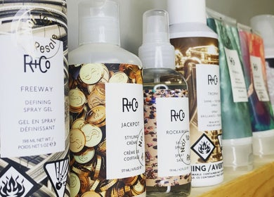Assorted R+Co hair products displayed neatly at Studio29 in Edmonton, Alberta, CA.