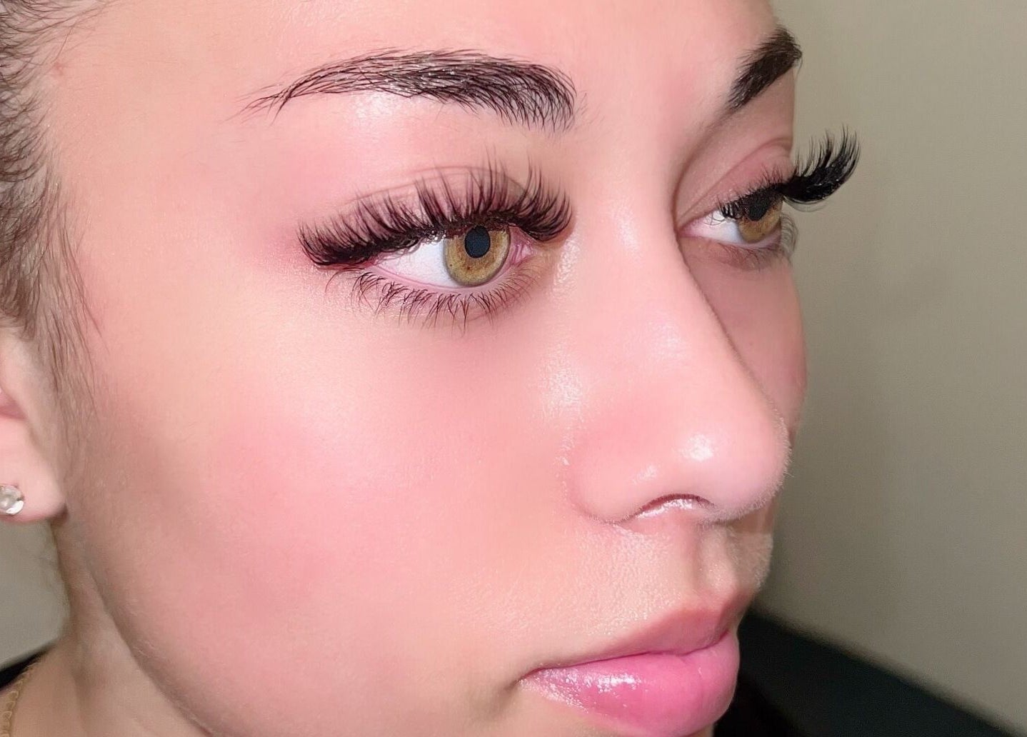 Close-up of a woman's eye with eyelash extensions at Merum Face Bar, Allen, Texas, US.