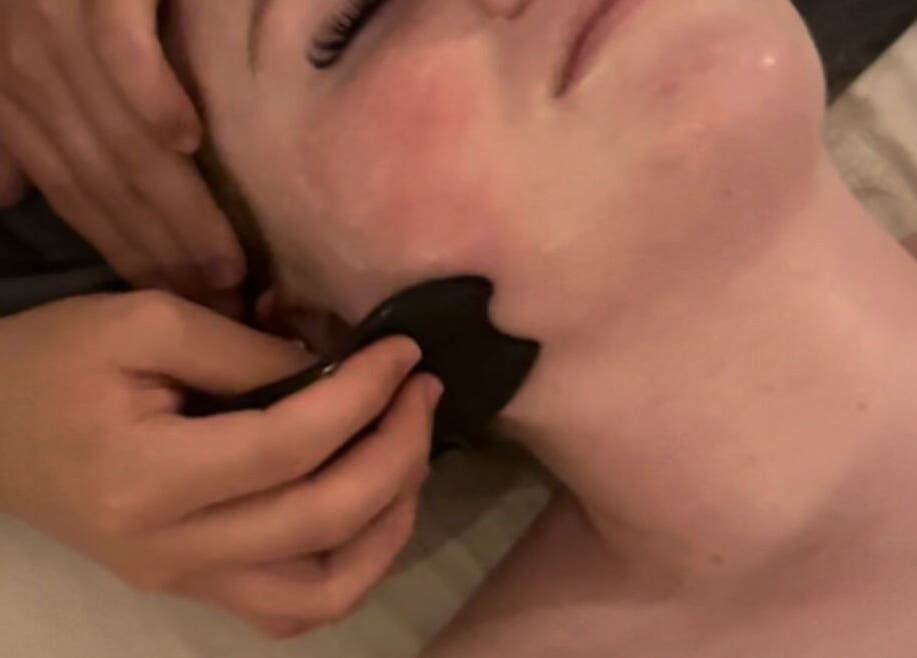 Facial Gua Sha massage at Merum Face Bar, Allen, Texas, US enhances relaxation and skin vitality.