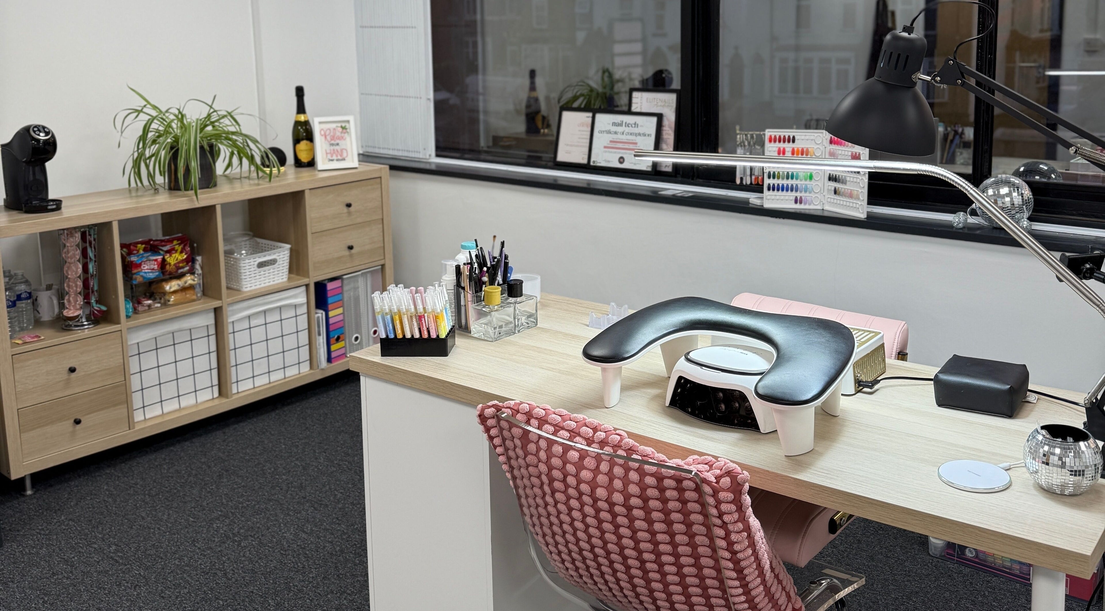 Chic nail station at Just Gelled Nails & Education in Halesowen, England, GB with modern decor and tools.