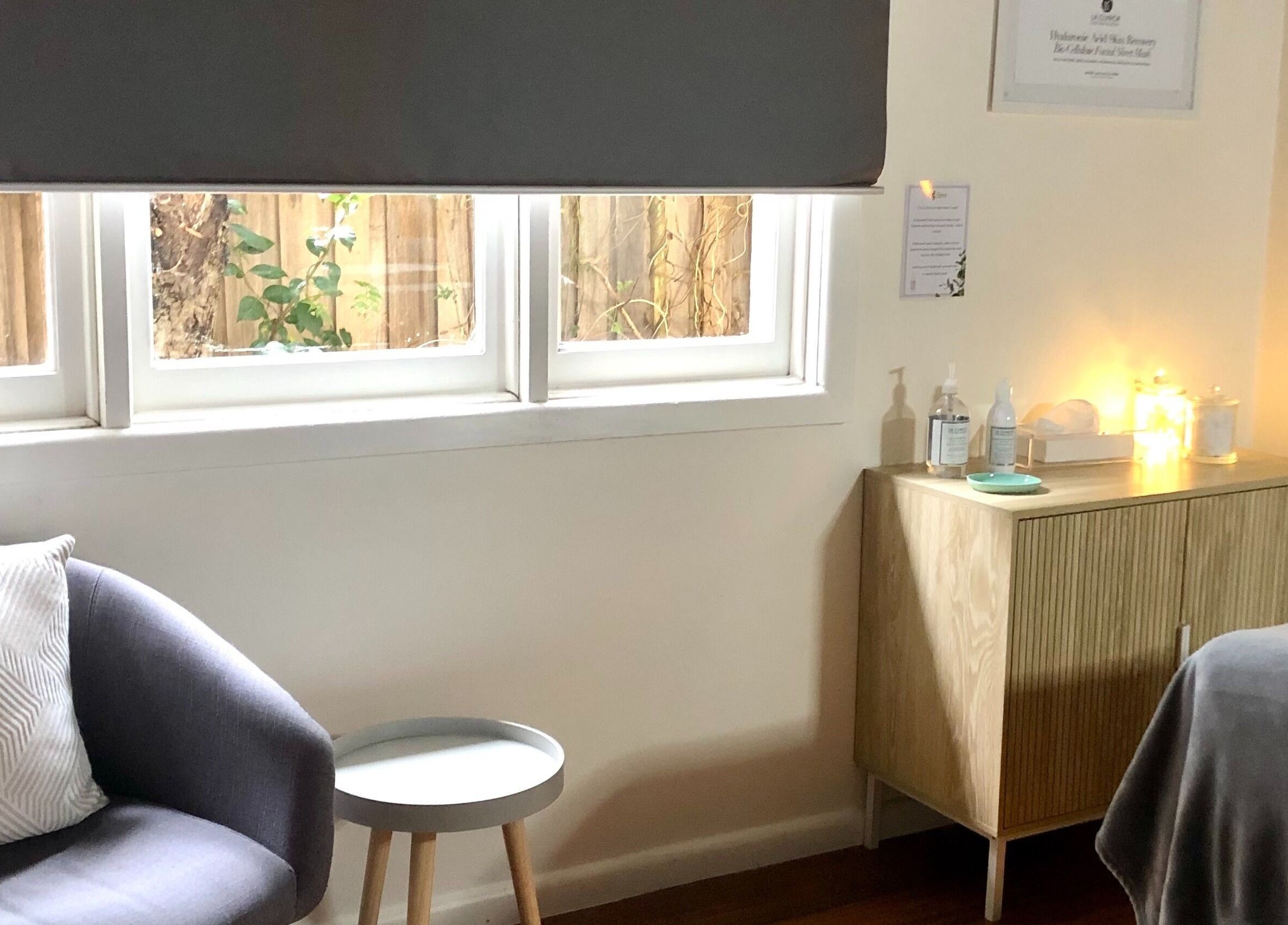 Cozy spa room at Balanced Beauty in Melbourne, Victoria, AU with a chair, soft lighting, and tranquil ambiance.