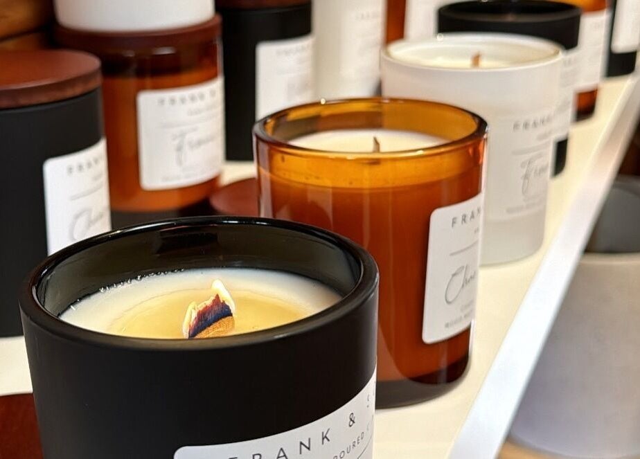 Assorted candles on a shelf, enhancing ambiance at Balanced Beauty, Melbourne, Victoria, AU.
