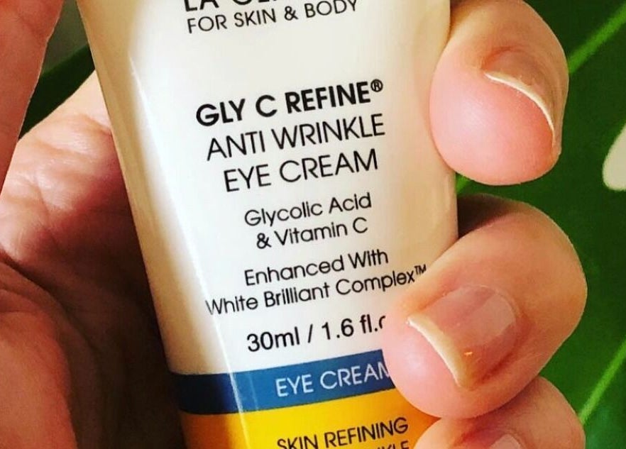 Hand holding Gly C Refine anti-wrinkle cream at Balanced Beauty, Melbourne, Victoria, AU.