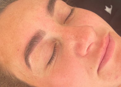Close-up of a relaxed face with groomed eyebrows at Keely Briany Beauty, Brighton, England, GB.