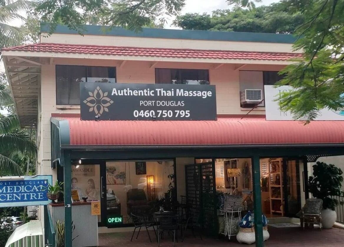 Entrance of Authentic Thai Massage Port Douglas in Port Douglas, Queensland, AU amidst lush greenery.