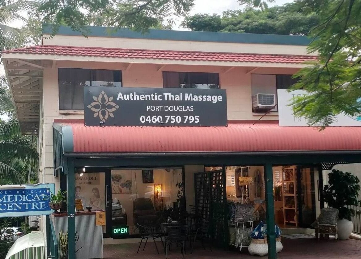 Entrance of Authentic Thai Massage Port Douglas in Port Douglas, Queensland, AU amidst lush greenery.